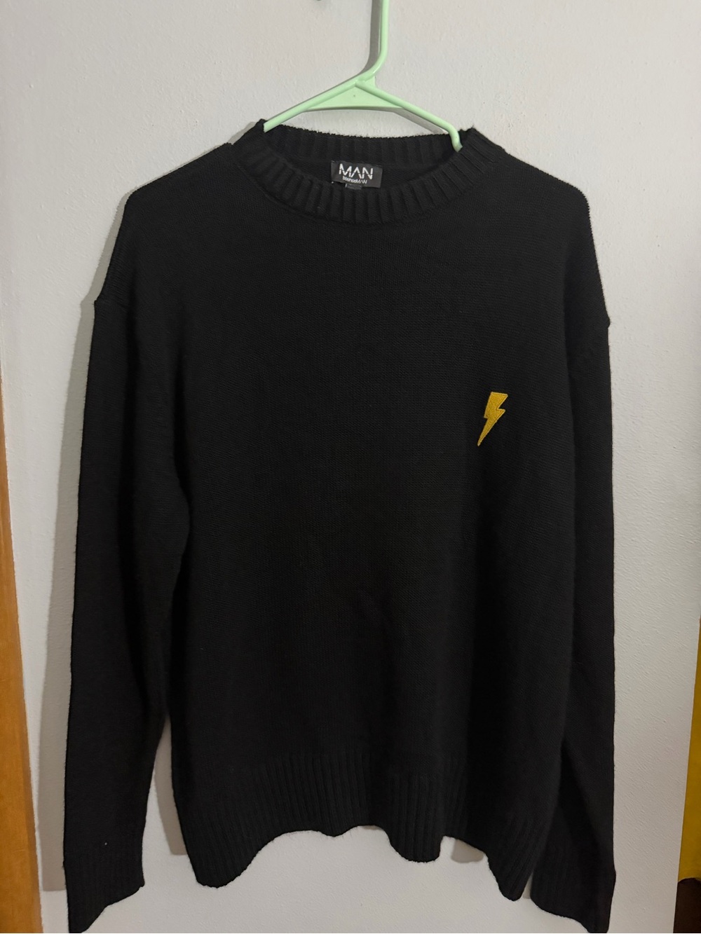 Black Crewneck Sweater with Yellow Lightning Accent